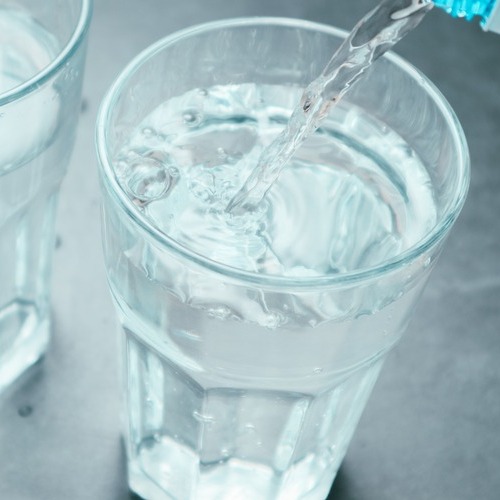 water being poured into a glass